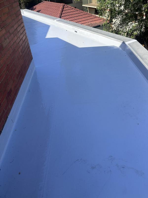 Waterproofing membrane detailed into a corner upstand